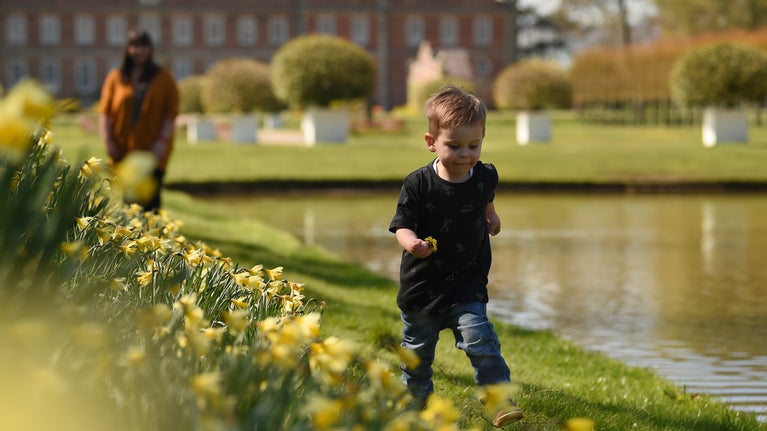 Boy running in the garden at Erddig, Wrexham, Wales